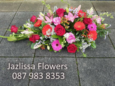 red and pink sympathy - picture is for illustration purposes only, as some flowers pictured may not be available